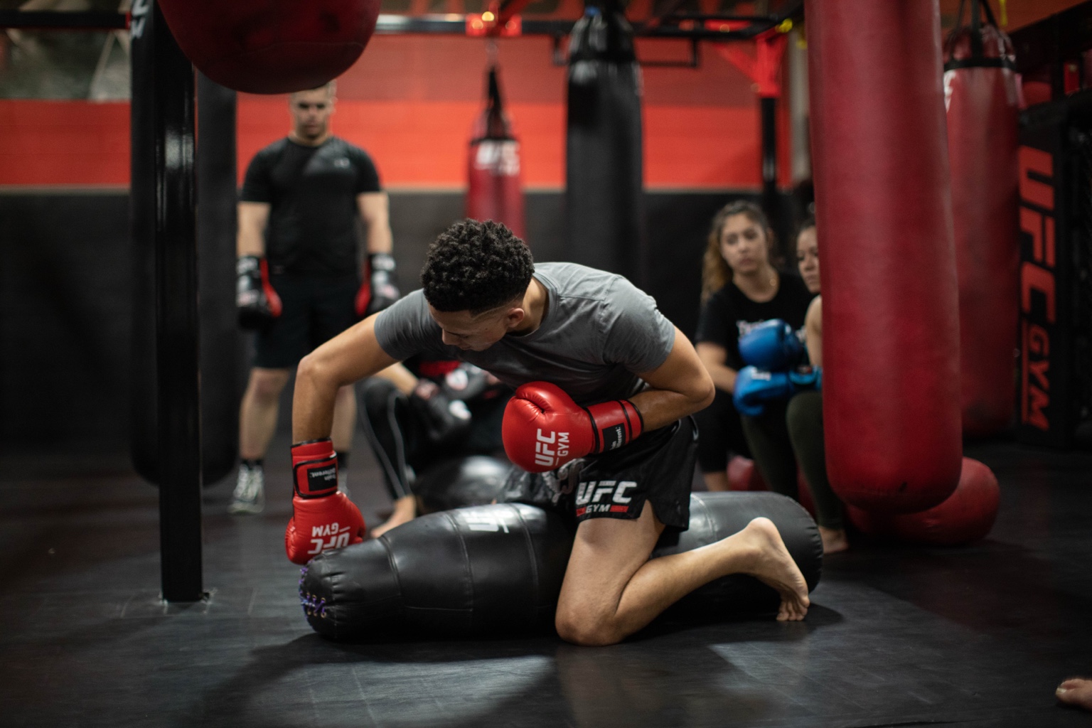 Martial arts class training inside a combat-sports gym